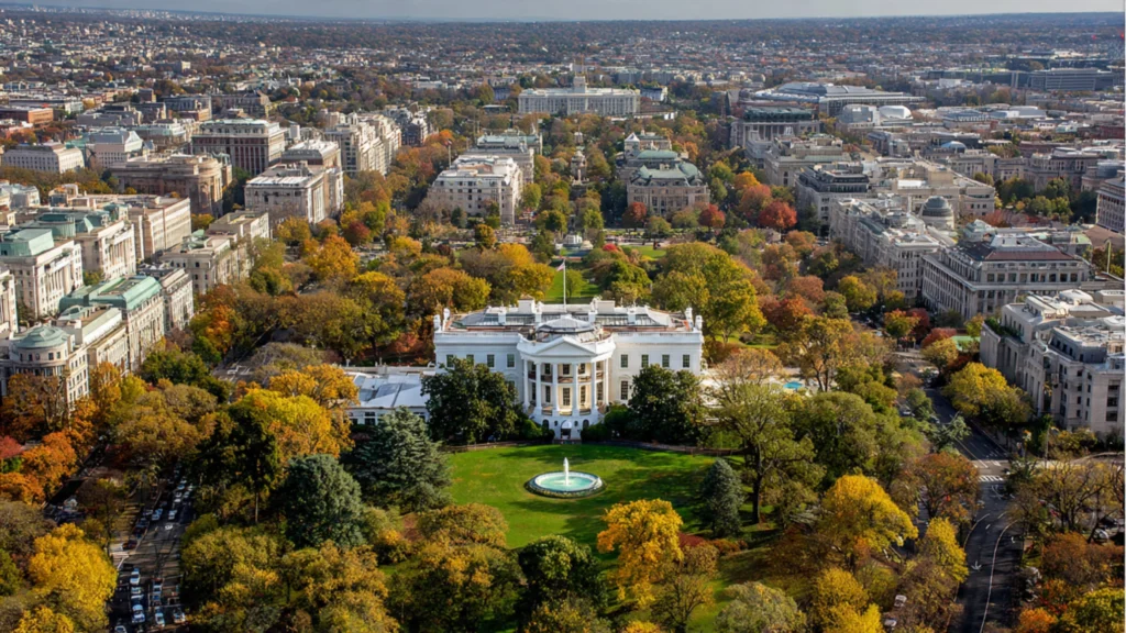 aerial view of the White House with Washington D.C. skyline
